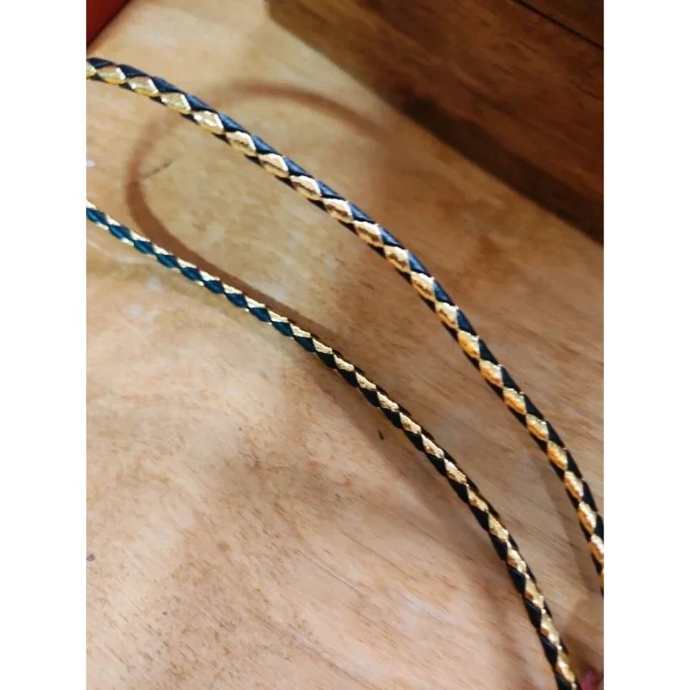 Fancy  agate bolo tie on gold and black cord